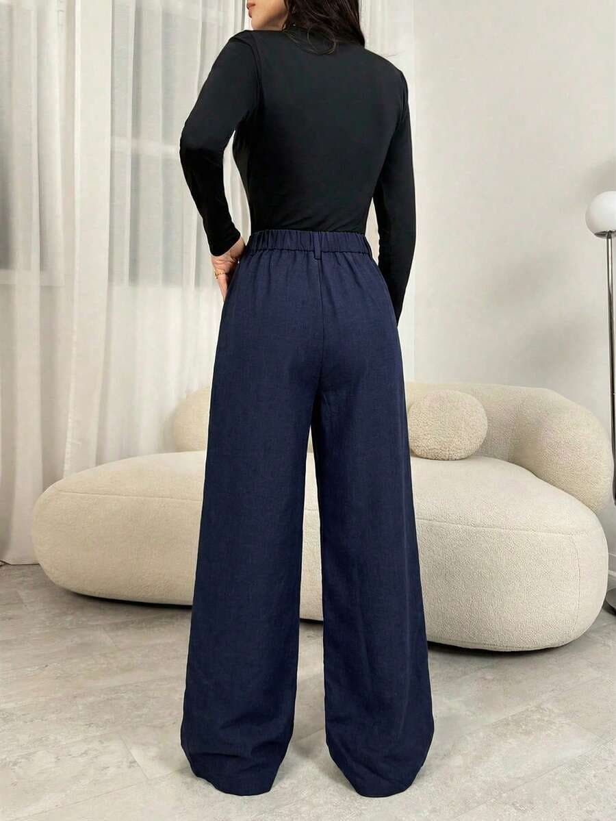 Stoffhose mit Bundfalten und weitem Bein